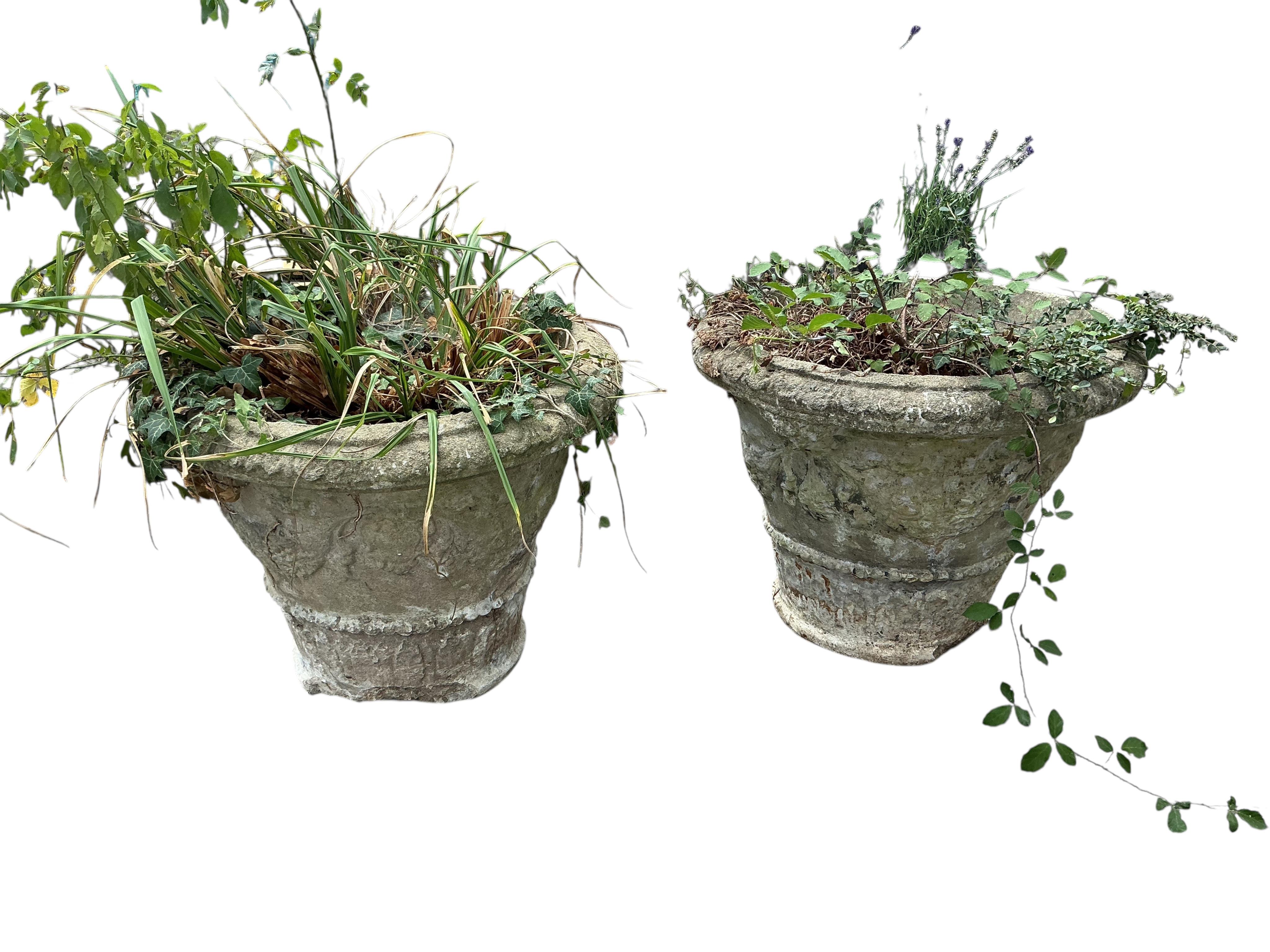 A pair of reconstituted stone garden planters, diameter 60cm, height 48cm